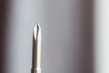Head of metal crosses screwdriver close-up on a blurred background. hand tool close up. copy space Royalty Free Stock Photo