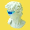 Head of Michelangelo`s David wearing mint green glasses