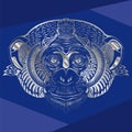 Head of monkey.Silver silhouette on a blue background.