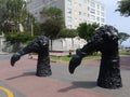 Head and neck of bird black statues in Barranco, Lima