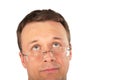 Head of pensive man in glasses look up Royalty Free Stock Photo