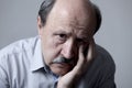 Head portrait of senior mature old man on his 60s looking sad and worried suffering pain and depression in sadness face expression Royalty Free Stock Photo