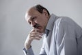 Head portrait of senior mature old man on his 60s looking sad and worried suffering pain and depression in sadness face expression Royalty Free Stock Photo