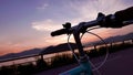 The head of retro bicycle and the frame silhouette at sunset Royalty Free Stock Photo