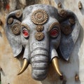 Head of a sacred elephant with a third eye, decorated with patterns,