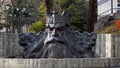 The head of the sea God Neptune. Sculpture of metal.