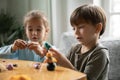 Happy cute small children siblings involved in handmade activity. Royalty Free Stock Photo