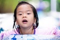 Head shot of Asian cute girl swimming with rubber ring. Summer time. Sport girl. Exercise kid. Active child aged 4-5 years old