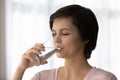 Head shot beautiful dehydrated young woman drinking pure mineral water Royalty Free Stock Photo