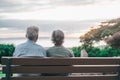 Head shot close up portrait happy grey haired middle aged woman with older husband, enjoying sitting on bench at park. Bonding Royalty Free Stock Photo