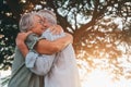 Head shot close up portrait happy grey haired middle aged woman snuggling to smiling older husband, enjoying tender moment at park Royalty Free Stock Photo