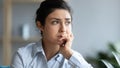 Head shot close up sad young indian woman thinking of problems. Royalty Free Stock Photo