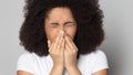 Head shot sick African American girl blowing nose, holding handkerchief Royalty Free Stock Photo