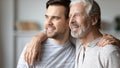 Dreamy positive two male generations family planning future. Royalty Free Stock Photo