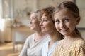 Happy three female generations family posing at home. Royalty Free Stock Photo