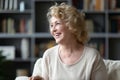 Happy 60s elderly woman looking at distance. Royalty Free Stock Photo