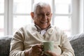Head shot happy smiling mature man holding cup of tea Royalty Free Stock Photo