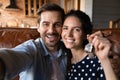 Head shot happy young couple showing keys, excited by relocation Royalty Free Stock Photo