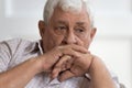 Head shot lonely upset older man lost in thoughts Royalty Free Stock Photo