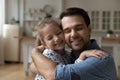 Head shot loving father and 8s daughter touching cheeks Royalty Free Stock Photo