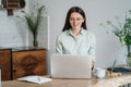 Head shot pleasant happy young woman freelancer working on computer at home. Attractive businesswoman studying online Royalty Free Stock Photo