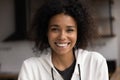 Head shot portrait beautiful African young woman pose indoors Royalty Free Stock Photo