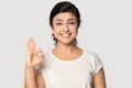 Head shot portrait smiling beautiful Indian girl showing ok gesture Royalty Free Stock Photo