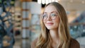 Head shot portrait Caucasian lady female girl in glasses pensive woman looking away ophthalmology services millennial Royalty Free Stock Photo