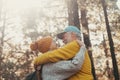 Head shot portrait close up of old people smiling and enjoying looking each other in the forest of mountain. Cute couple of mature