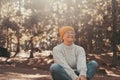 Head shot portrait close up of one middle age old woman resting and relaxing doing yoga in the forest of mountain in the nature. Royalty Free Stock Photo