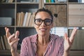 Head shot portrait confident businesswoman coach wearing glasses looking at camera and talking, mentor speaker holding online Royalty Free Stock Photo