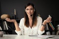 Head shot portrait confident businesswoman looking at camera and talking by headphones. Royalty Free Stock Photo