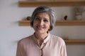 Head shot portrait of good-looking elegant middle-aged woman