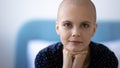 Head shot portrait hairless young woman struggling with cancer