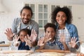 Head shot portrait happy African American family cooking together Royalty Free Stock Photo