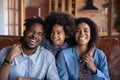 Head shot portrait happy African American family with daughter hugging Royalty Free Stock Photo