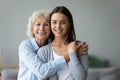 Head shot portrait happy caring grandmother hugging granddaughter Royalty Free Stock Photo