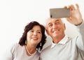 Head shot portrait happy elderly couple taking selfie Royalty Free Stock Photo