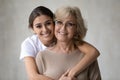 Head shot portrait loving daughter hugging mature mother from back Royalty Free Stock Photo