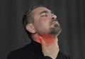 Head shot portrait man touch neck feels pain in throat