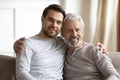 Head shot portrait mature father with adult son hugging Royalty Free Stock Photo