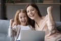 Head shot portrait overjoyed mother and little girl celebrating success