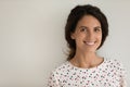 Head shot portrait of smiling woman on grey studio background Royalty Free Stock Photo