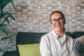 Head shot portrait smart confident smiling middle age caucasian woman standing with folded arms at home. Attractive young lady Royalty Free Stock Photo