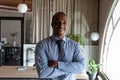 Head shot portrait smiling African American businessman with arms crossed Royalty Free Stock Photo