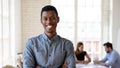 Head shot portrait smiling African American businessman in office Royalty Free Stock Photo