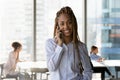 Head shot portrait smiling African American businesswoman making phone call Royalty Free Stock Photo