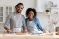 Head shot portrait smiling African American couple cooking cookies together Royalty Free Stock Photo