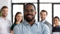 Head shot portrait smiling African American executive wearing glasses Royalty Free Stock Photo