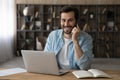 Head shot portrait smiling businessman talking on phone, using laptop Royalty Free Stock Photo